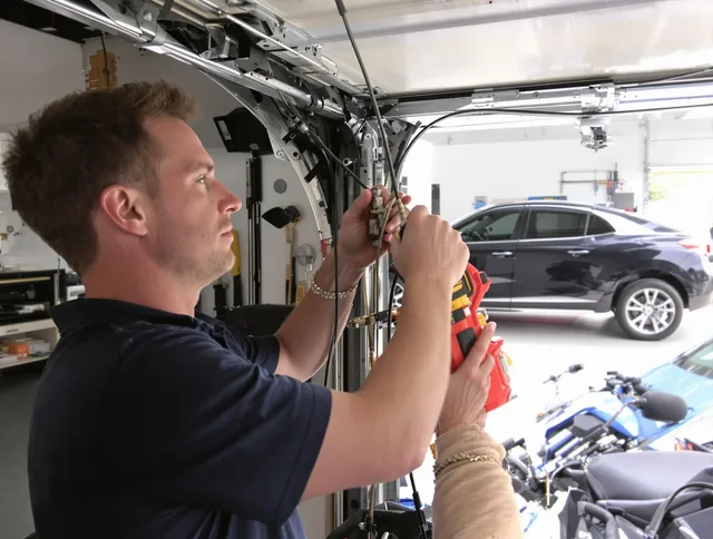 Claremont Garage Door Repair safety certified technician performing cable replacement in Claremont