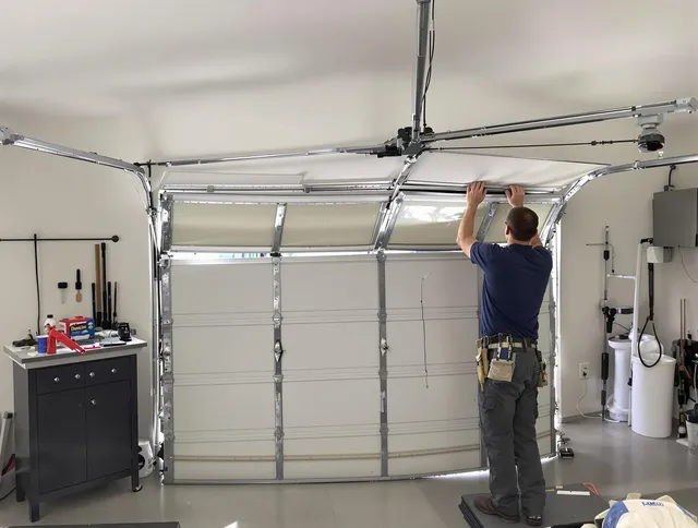 Claremont Garage Door Repair specialist performing precise section replacement on Claremont garage door